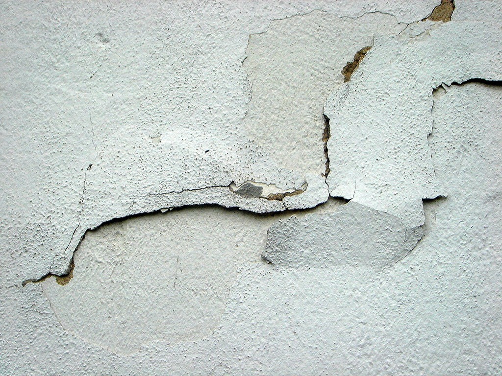 Crack plaster house building. A crack in the wall of a building.